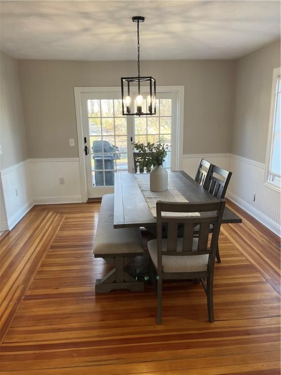 dining room with a chandelier and hardwood / wood-style floors