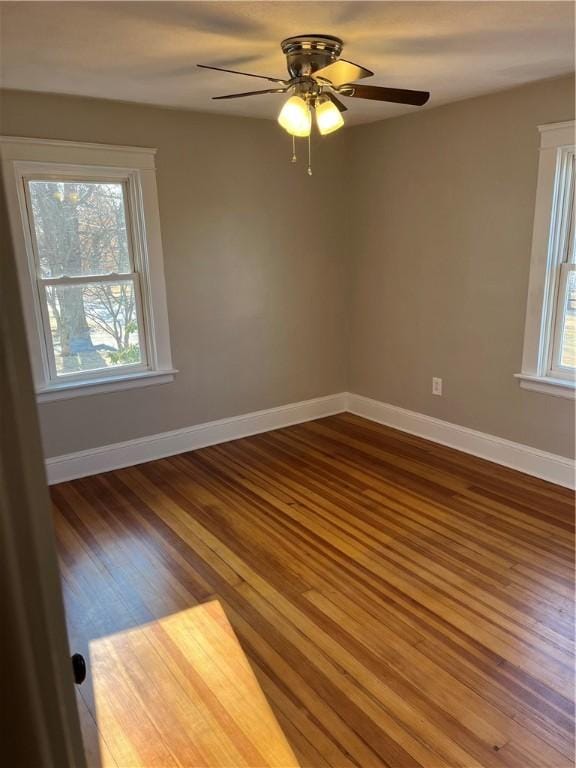 spare room featuring ceiling fan and wood-type flooring