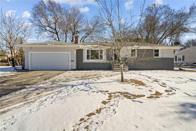 ranch-style house featuring a garage