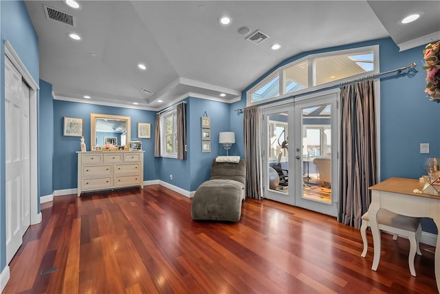 sitting room with vaulted ceiling, wood-type flooring, and french doors