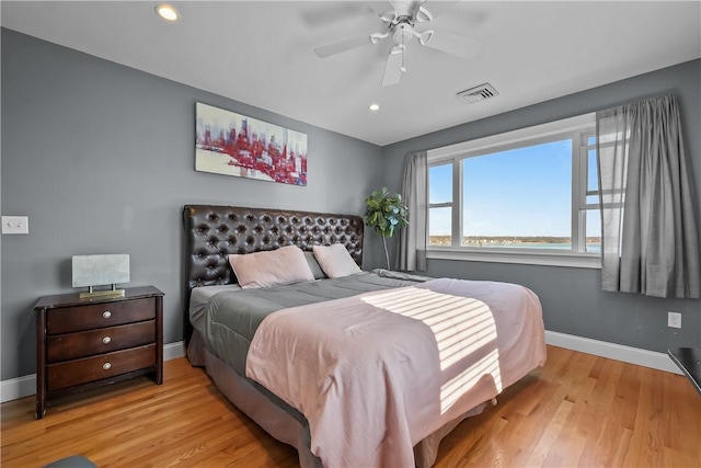 bedroom featuring ceiling fan and light hardwood / wood-style floors