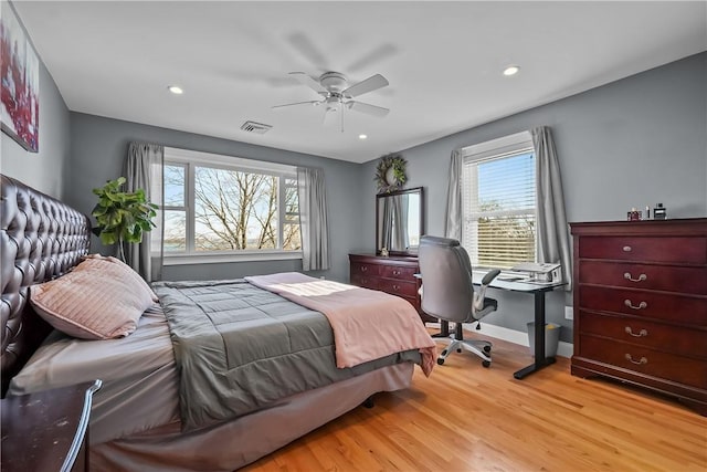 bedroom with light wood-type flooring and ceiling fan