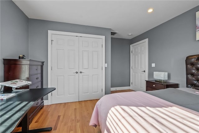 bedroom with a closet and light wood-type flooring