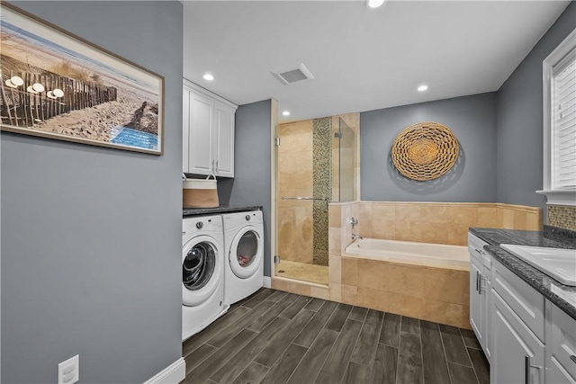 laundry room with washing machine and dryer and sink