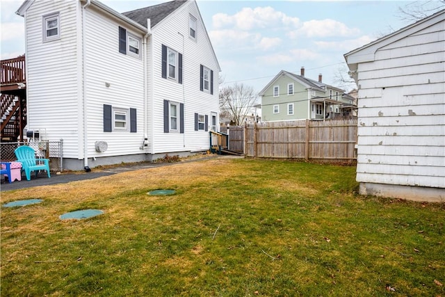 rear view of house featuring a lawn