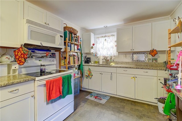 kitchen featuring light stone counters, sink, white appliances, and white cabinetry