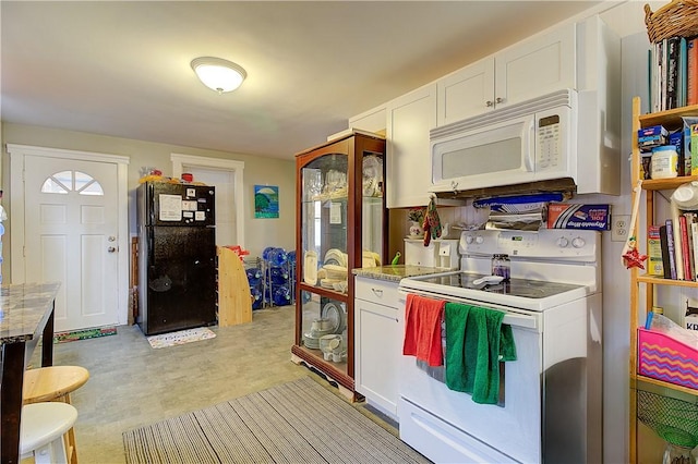 kitchen with white cabinets and white appliances