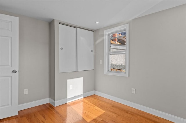 unfurnished bedroom featuring light wood-type flooring