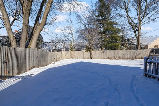 view of yard layered in snow