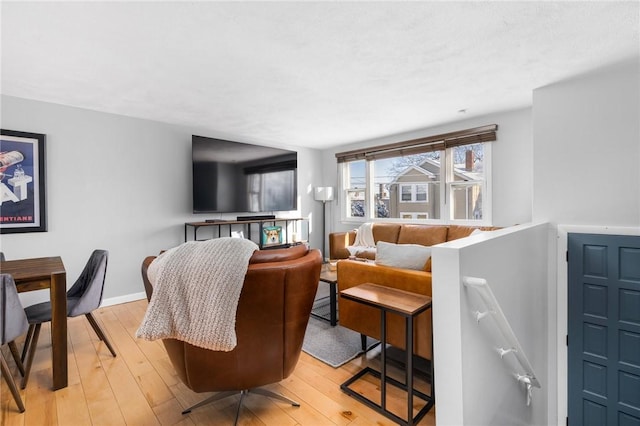 living room with light hardwood / wood-style flooring