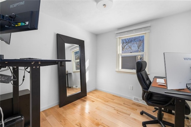 office with hardwood / wood-style flooring