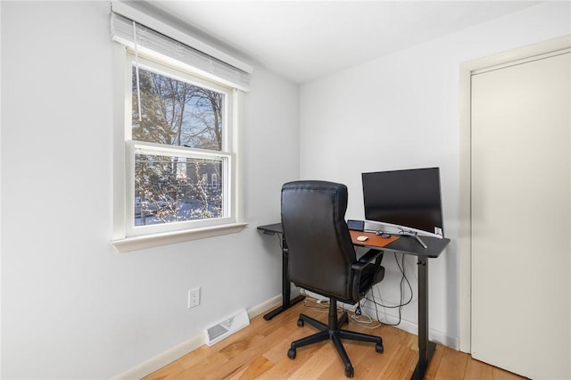 office space featuring light hardwood / wood-style floors