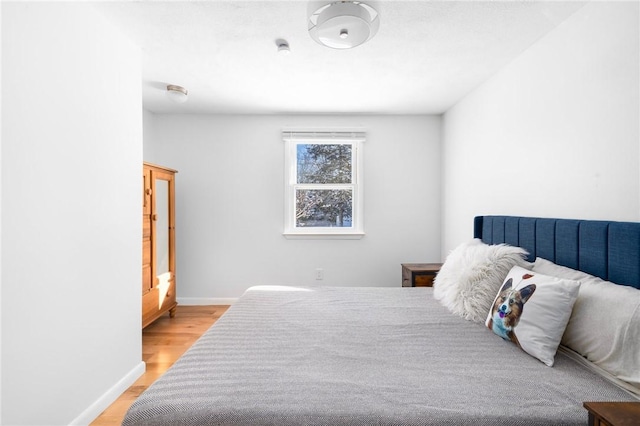 bedroom with light hardwood / wood-style floors