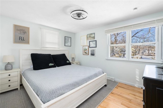 bedroom with hardwood / wood-style flooring