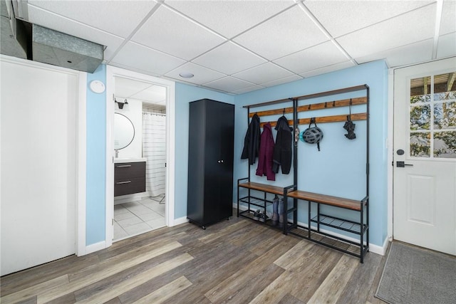 mudroom featuring a drop ceiling and wood-type flooring