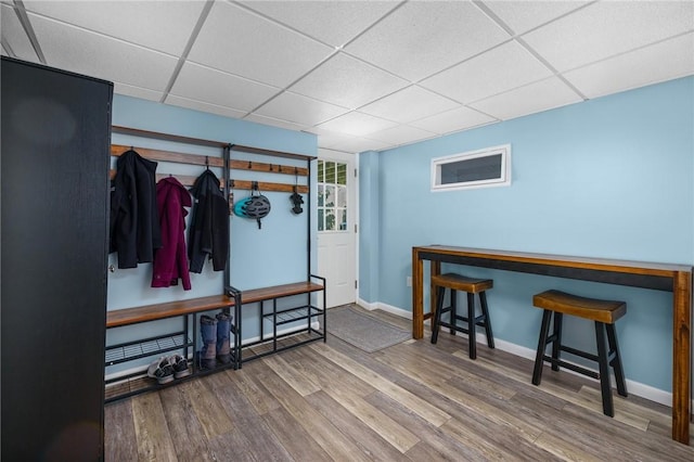 mudroom featuring a drop ceiling and hardwood / wood-style flooring