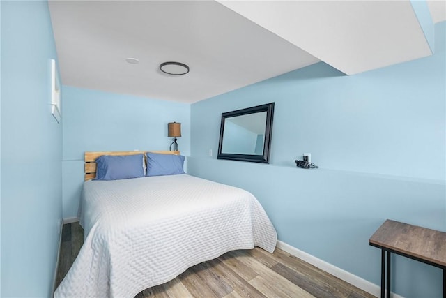 bedroom with wood-type flooring