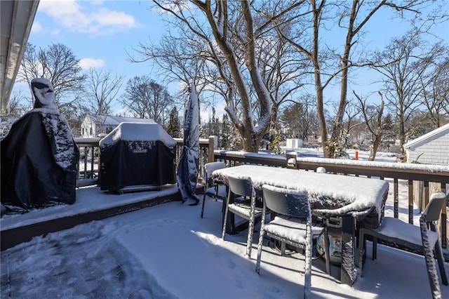 snow covered patio with grilling area