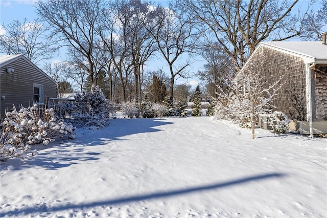 view of yard covered in snow