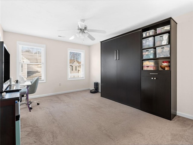 home office with ceiling fan and light colored carpet