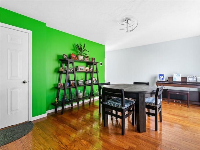 dining area with hardwood / wood-style flooring