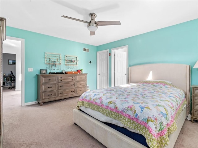 bedroom with light carpet and ceiling fan