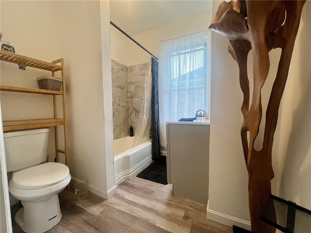 bathroom with wood-type flooring, toilet, and shower / bath combination with curtain