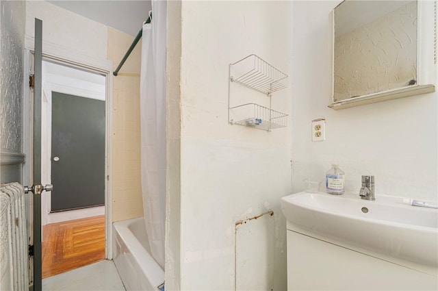 bathroom with vanity and shower / tub combo with curtain