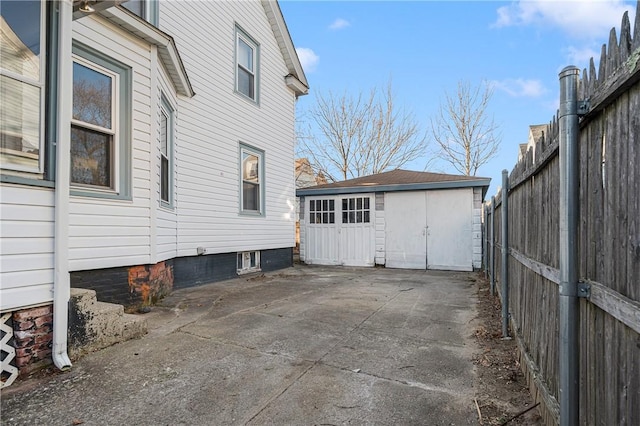 view of side of property with a garage and an outdoor structure