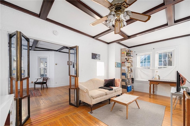 living room with coffered ceiling, ceiling fan, hardwood / wood-style flooring, and beamed ceiling