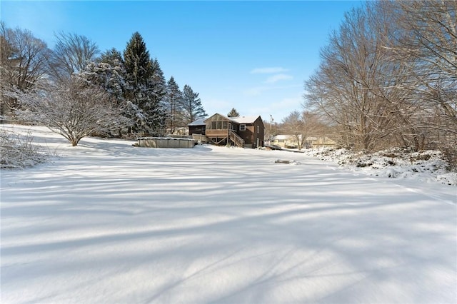 view of yard layered in snow