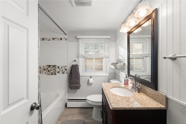 full bathroom with a baseboard heating unit, vanity, toilet, and shower / tub combo with curtain