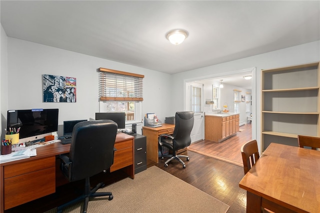 office with light hardwood / wood-style floors