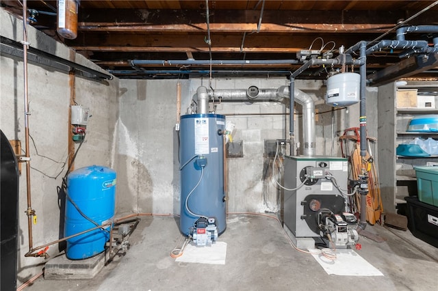 utility room featuring water heater