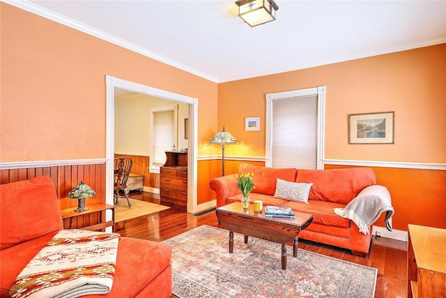 living room with ornamental molding and hardwood / wood-style floors