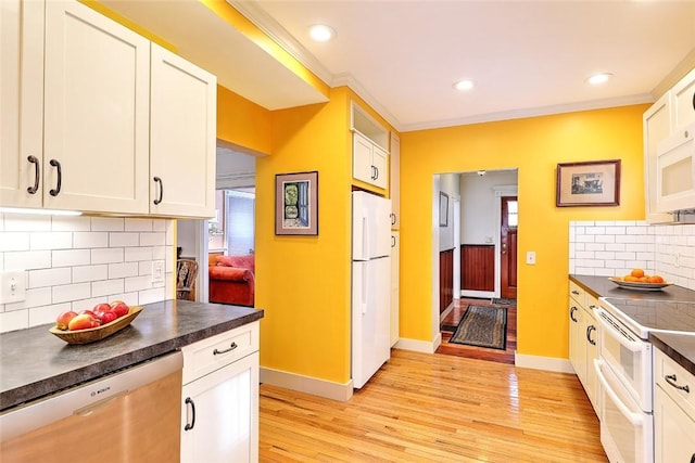 kitchen featuring white appliances, white cabinets, backsplash, light wood-type flooring, and crown molding