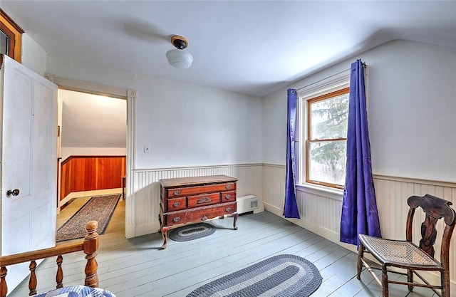 living area featuring lofted ceiling and light wood-type flooring