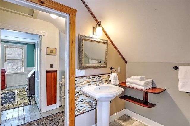 bathroom with sink and vaulted ceiling