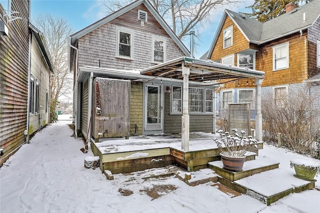 view of snow covered house