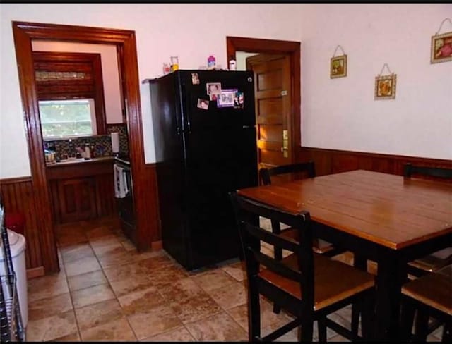 kitchen featuring black refrigerator