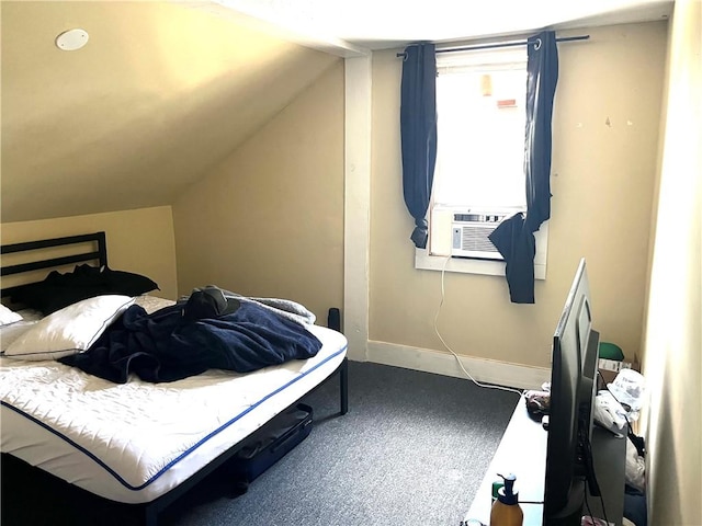 carpeted bedroom featuring cooling unit and vaulted ceiling