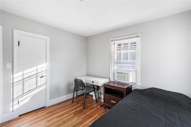 bedroom featuring cooling unit and hardwood / wood-style floors