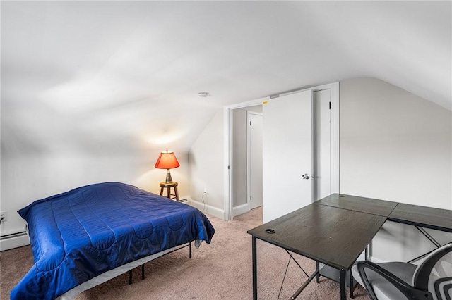 bedroom with vaulted ceiling, baseboard heating, and carpet floors