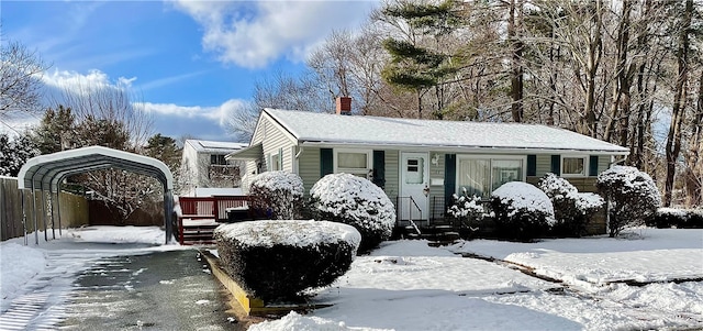 view of front of home with a carport