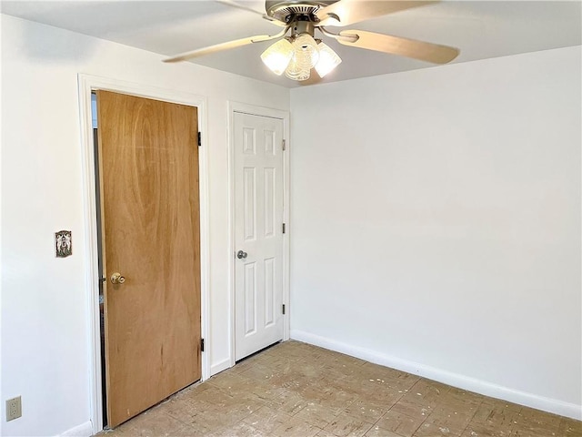 spare room with ceiling fan