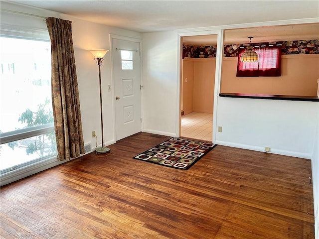 entryway with wood-type flooring