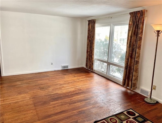 empty room featuring hardwood / wood-style floors