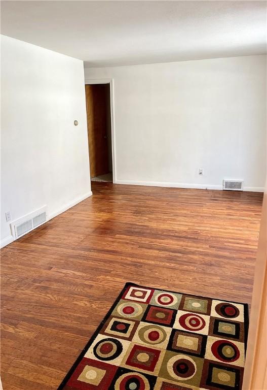 spare room featuring hardwood / wood-style floors