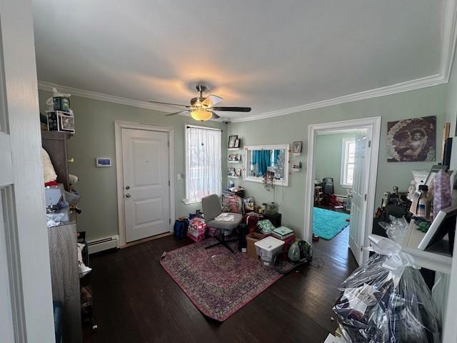 interior space with crown molding, dark wood-type flooring, and a baseboard radiator