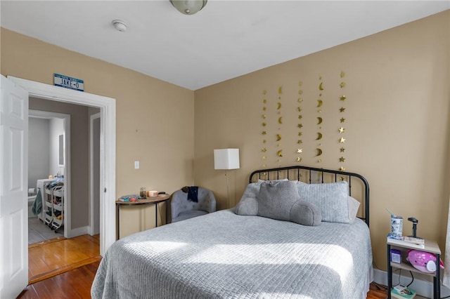 bedroom with hardwood / wood-style flooring